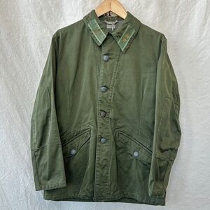 Swedish military jacket with decorated lapels, embossed buttons, multi-pockets.